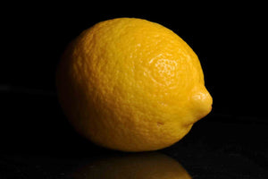Ripe lemon with a black background